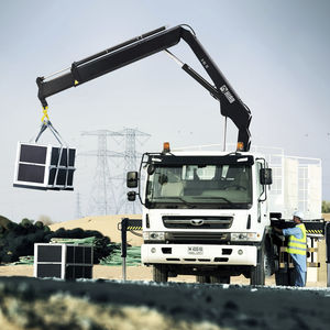 gru montata su camion / con braccio / pieghevole / per cantiere di costruzione