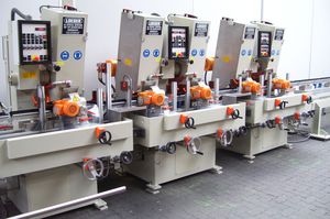 rettificatrice senza centri / piana / per tubi / controllata da PLC