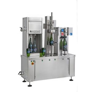 sciacquatrice / riempitrice / chiuditrice per bottiglie in plastica