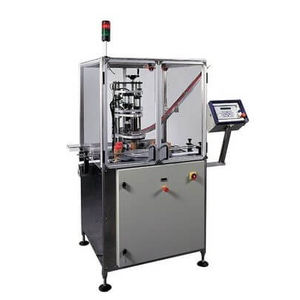 posatrice di coperchi automatica