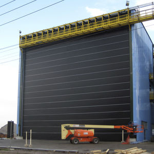 porte industriali / ad impacchettamento / per hangar / per cantieri navali