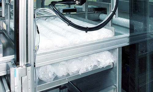 Sleeveratrice automatica - Vertisleever - Kiefel GmbH - per tubi flessibili / per bicchieri