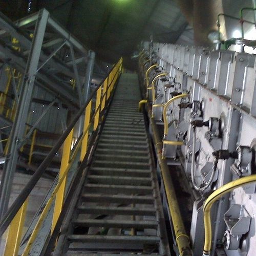 Trasportatore a nastro - Ecobelt® DRI - Magaldi Power SpA - inclinato / per movimentazione / chiuso