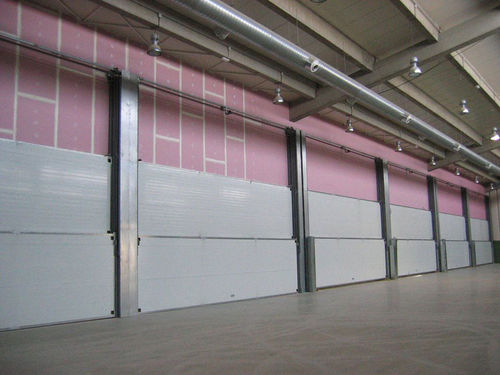 Porta scorrevole verticale - Talleres Alfa Torres - a lame multiple / in metallo / industriale