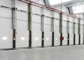 Porta sezionale - Alapontlogistics - industriale / per interno / per isolamento acustico