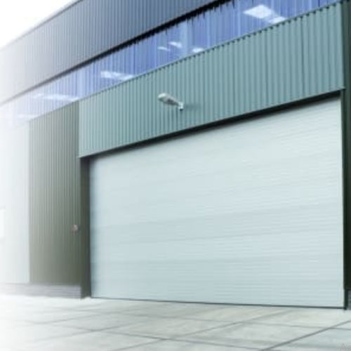 Porta scorrevole - Loading Systems International - sezionale / industriale / per hangar