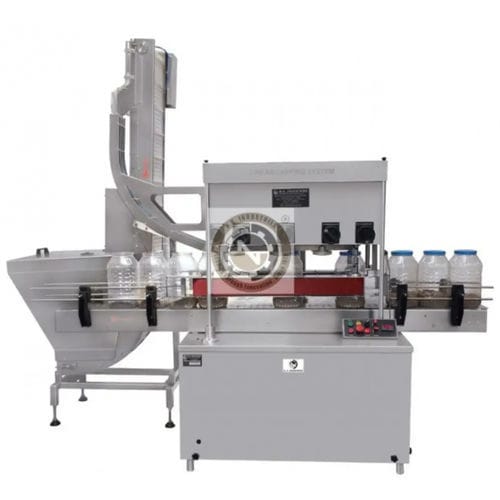 Incapsulatrice lineare - N.K. INDUSTRIES - controllata da PLC / a motore / per bottiglie