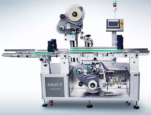 Etichettatrice controllata da PLC - UDPM-ALS104 Series - skiltpack - per cartoni / per sacchi / per applicazione sulla parte superiore del prodotto