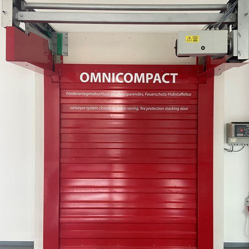 Porta ad avvolgimento - Omnicompact - STOBICH FRANCE - in metallo / per nastro trasportatore / di grandi dimensioni