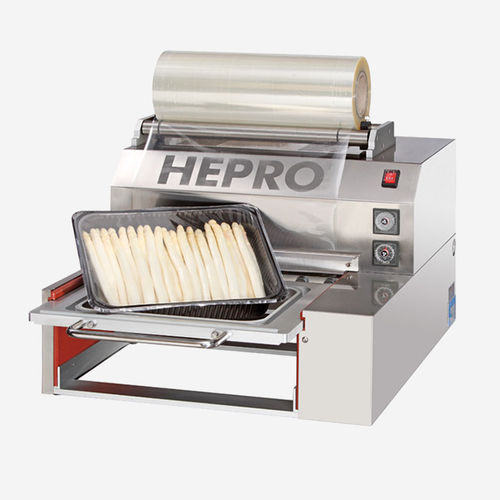 Sigillatrice automatica - Hepro GmbH Maschinen und Spezialgeräte Nahrungsmitteltechnik - per imballaggio di prodotti alimentari / di vassoi