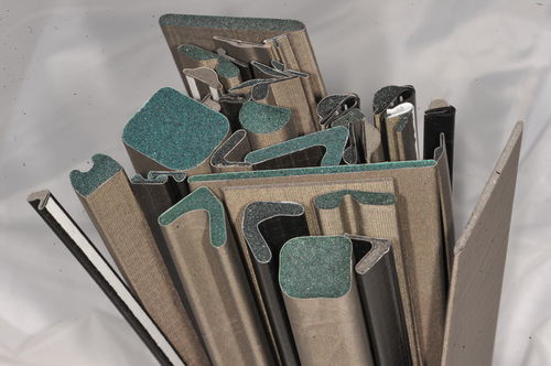 Guarnizione in tessuto conduttivo su schiuma - Schlegel Electronic Materials - piatta / in ottone / di rame