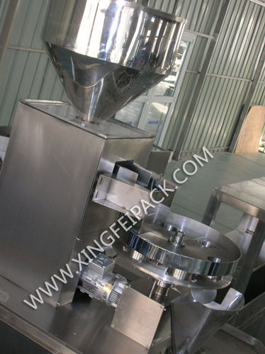 Dosatore di granulato - Shanghai Xingfei Packaging Machinery Co., Ltd. - volumetrico / automatico / a tavola rotante
