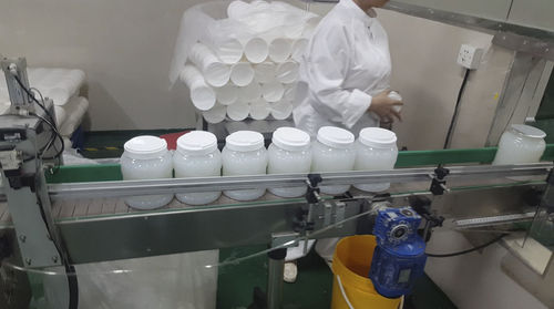 Linea di riempimento semiautomatica - Ttma Guangzhou Co., Ltd. - per bottiglie / per bevande / per olio di lubrificazione