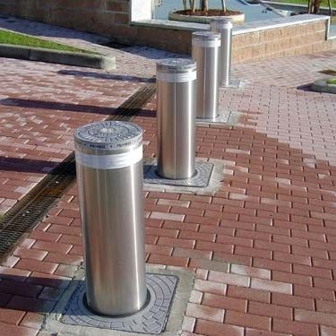 Dissuasore a scomparsa automatico - Wilcox Door Service Inc - idraulico / in acciaio