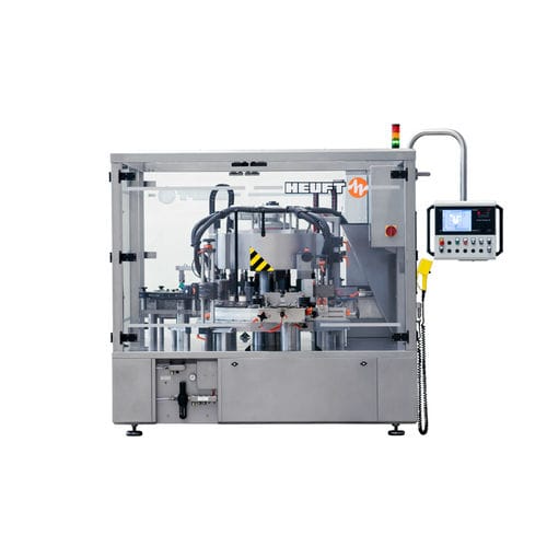 Macchina di etichettatura automatica - TORNADO R - HEUFT SYSTEMTECHNIK - per bottiglie / wraparound / per l'industria delle bevande