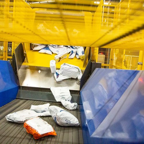 Sistema di scarico per pacchi - VANDERLANDE - per camion / per pallet / armatura