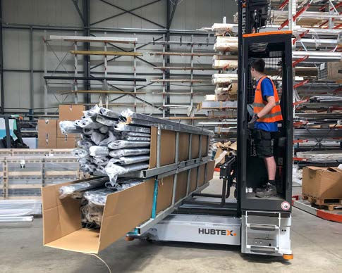 Carrello elevatore laterale elettrico - 2821 - HUBTEX - con conducente in piedi / per movimentazione / di stoccaggio
