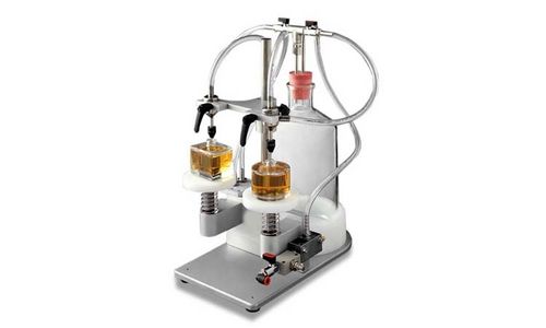 Riempitrice semiautomatica - VACUFILL - Omas Tecnosistemi S.p.a. - multicontenitore / per liquido / per profumi