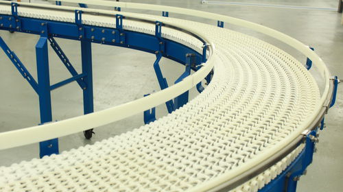Trasportatore a catena - SpanTech - curvo / per cartone / per l'industria agroalimentare