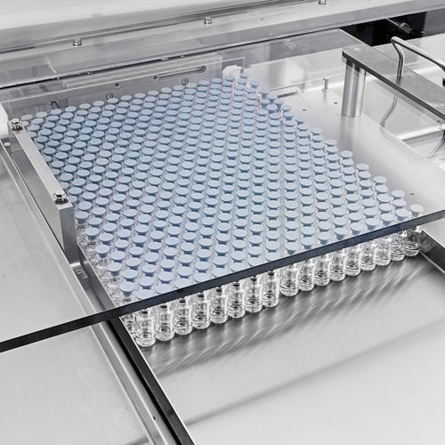 Sistema di carico per vaschette - Cozzoli Machine Company