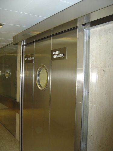 Porta scorrevole - ALFATECO MADRID S.A. - in acciaio inossidabile / in alluminio anodizzato / per interno