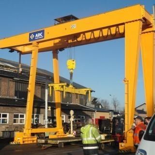 Gru a cavalletto su guida di scorrimento - ADC - per applicazioni marine / per cantieri di prefabbricati / da scaricamento navi