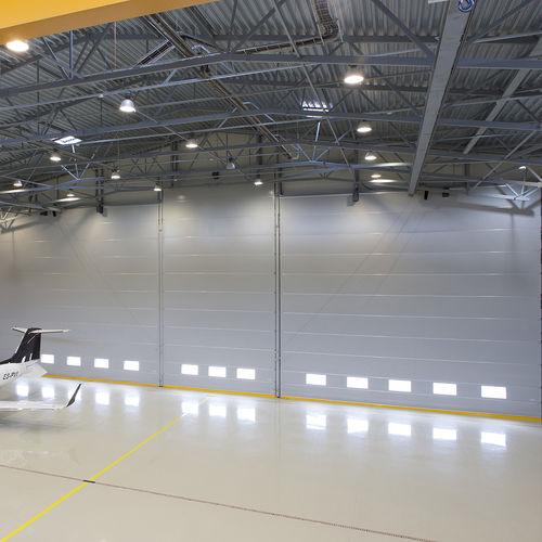 Porta per hangar - Business jet - Champion Door - ad impacchettamento / per hangar per aerei / ad alta resistenza