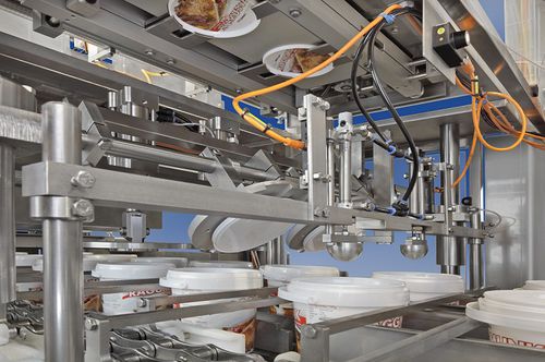 Posatrice di coperchi automatica - Robot Food Technologies Germany GmbH