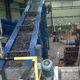 trasportatore a nastro / con nastro metallico / per movimentazione / per pezzi
