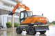 escavatore intermedio / gommato / diesel / per cantiere di costruzione